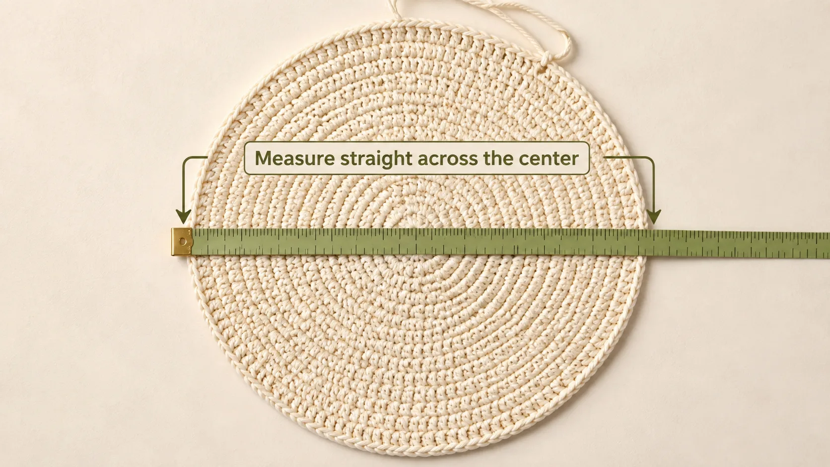 Crochet crown laid flat and measured straight across the center.